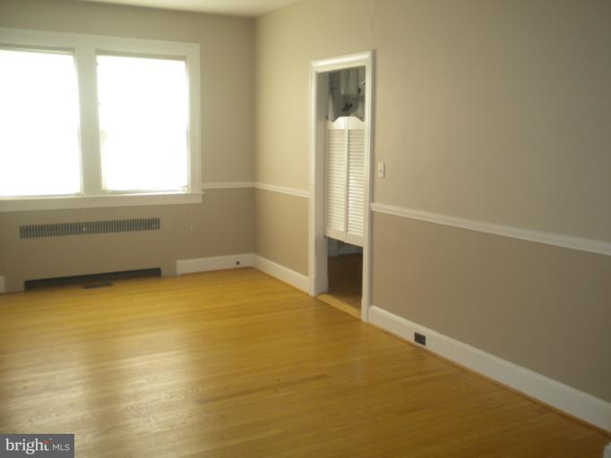 305 Hopkins Road Baltimore, MD 21212 - Photo 10 of 30 an empty room with windows and entrance