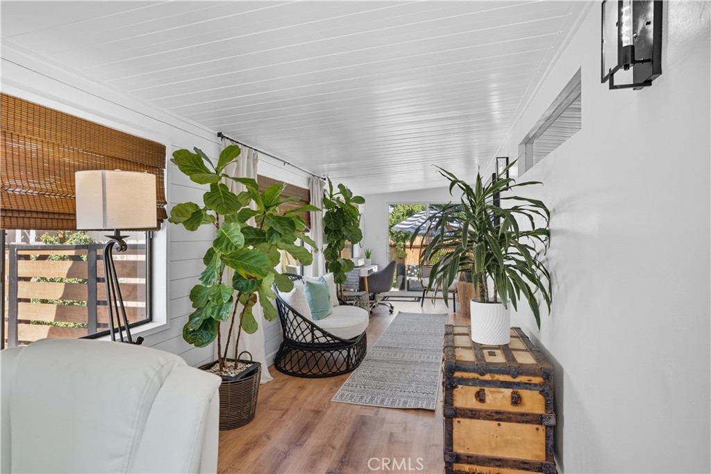 1120 East Mission Road, Unit 33 Fallbrook, CA 92028 - Photo 14 of 47 a vase of flowers sitting on a table in front of a door