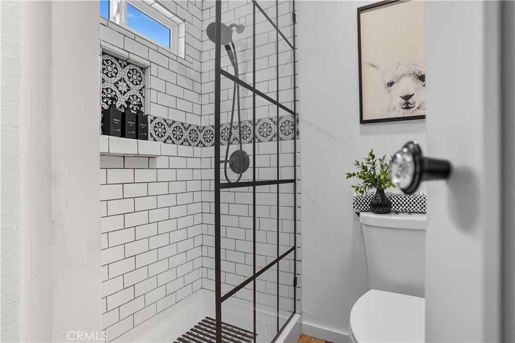 1120 East Mission Road, Unit 33 Fallbrook, CA 92028 - Photo 21 of 47 a bathroom with a toilet and a shower