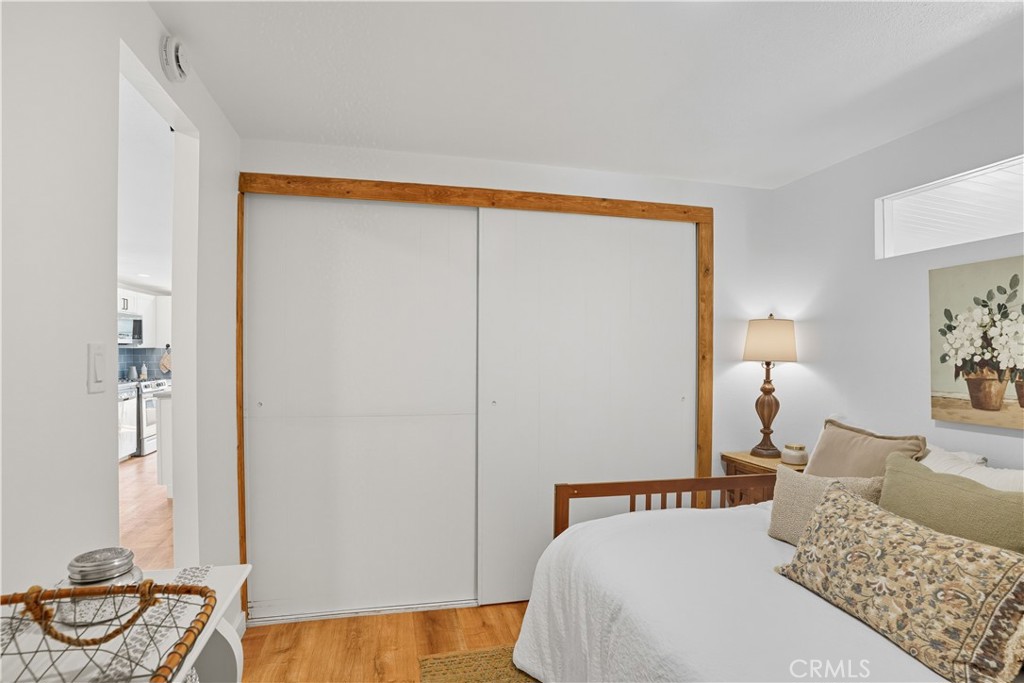 1120 East Mission Road, Unit 33 Fallbrook, CA 92028 - Photo 25 of 47 a bedroom with a bed and ceiling fan