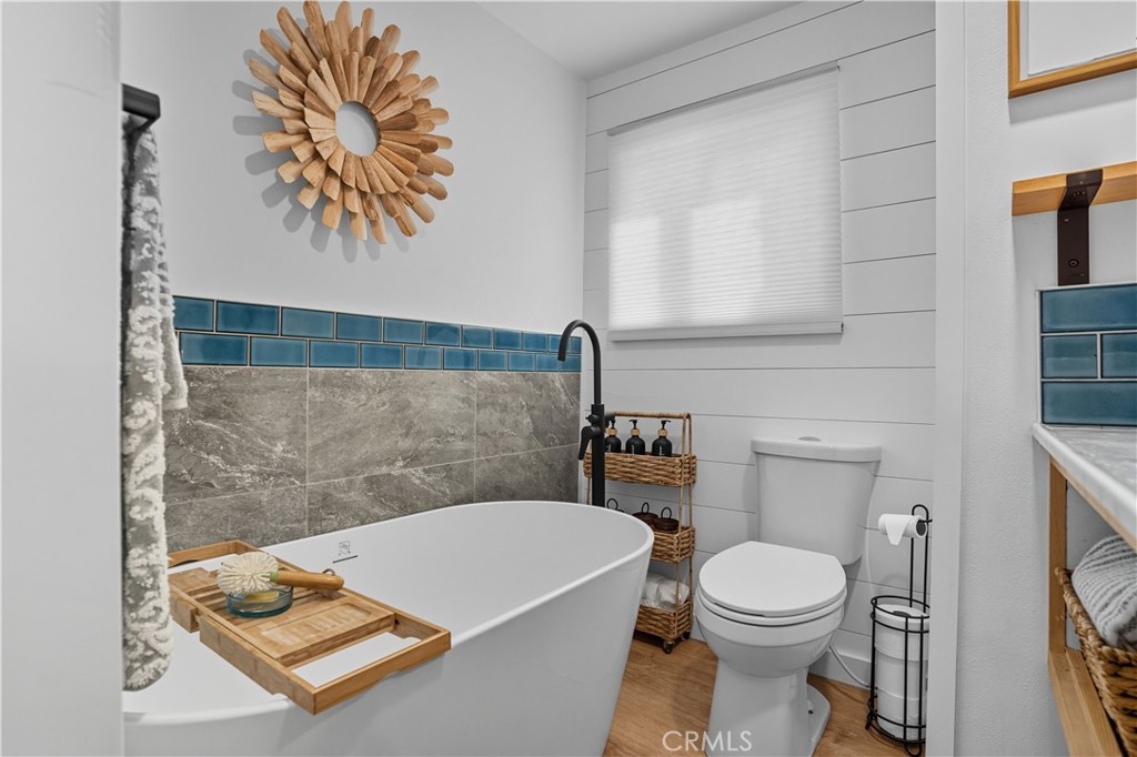 1120 East Mission Road, Unit 33 Fallbrook, CA 92028 - Photo 26 of 47 a bathroom with a toilet a sink and a shower