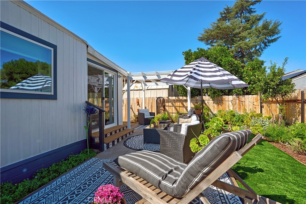 1120 East Mission Road, Unit 33 Fallbrook, CA 92028 - Photo 32 of 47 a view of a patio with couches table and chairs and potted plants