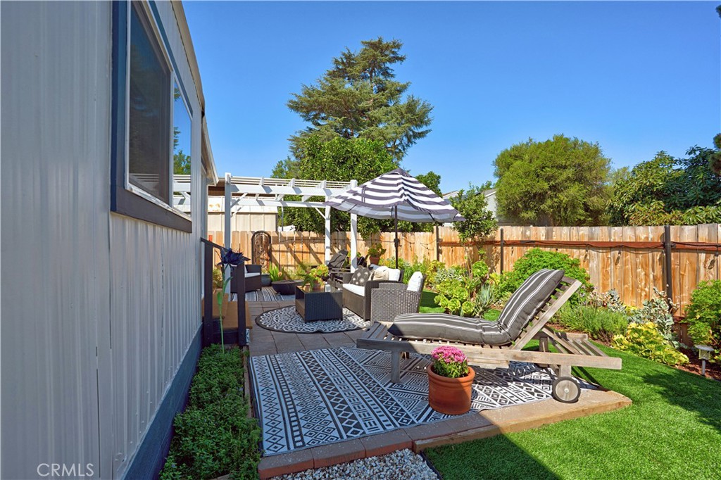 1120 East Mission Road, Unit 33 Fallbrook, CA 92028 - Photo 33 of 47 a view of balcony with chairs and potted plants