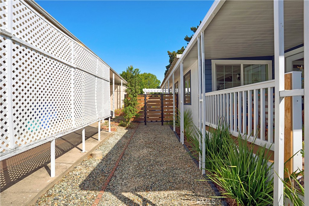 1120 East Mission Road, Unit 33 Fallbrook, CA 92028 - Photo 39 of 47 a view of a pathway of a house with wooden fence