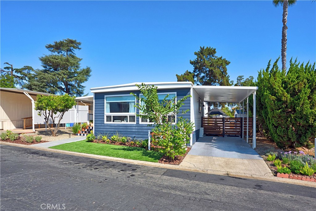 1120 East Mission Road, Unit 33 Fallbrook, CA 92028 - Photo 41 of 47 front view of a house with a yard