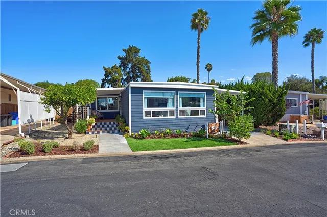 an aerial view of a house with garden space and street view