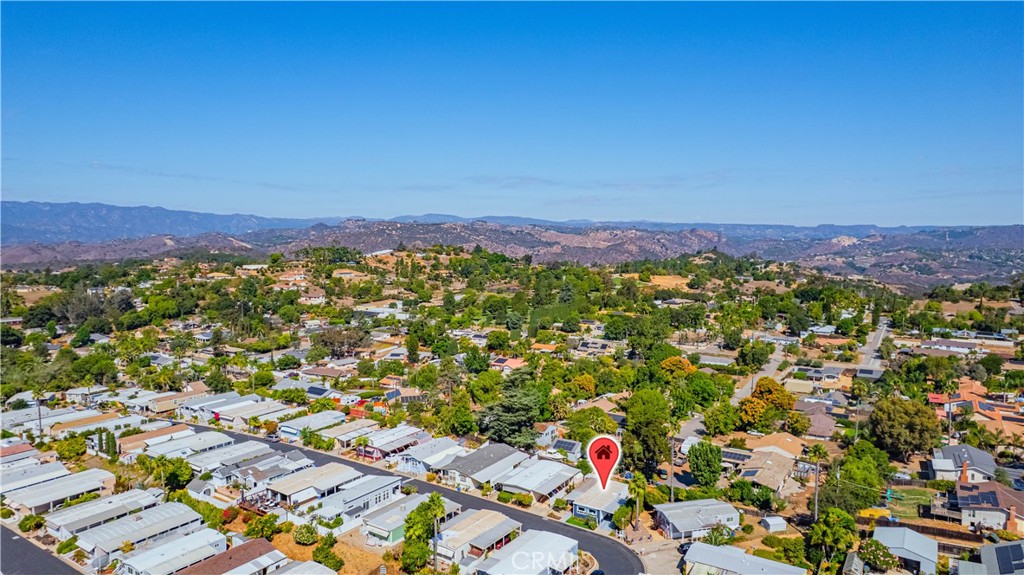 1120 East Mission Road, Unit 33 Fallbrook, CA 92028 - Photo 45 of 47 an aerial view of residential houses with outdoor space