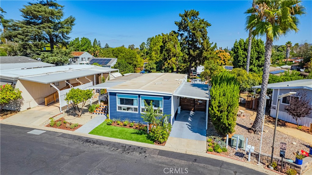 1120 East Mission Road, Unit 33 Fallbrook, CA 92028 - Photo 46 of 47 aerial view of a house with a yard and potted plants