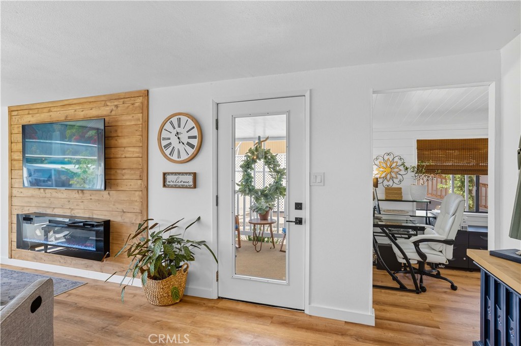 1120 East Mission Road, Unit 33 Fallbrook, CA 92028 - Photo 10 of 47 a view of a hallway with furniture and a potted plant