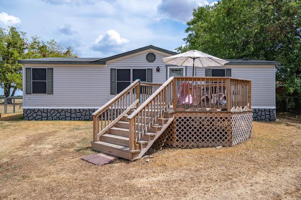 618 County Road 3416 Wills Point, TX 75169 - Photo 1 of 1 a front view of a house with wooden fence