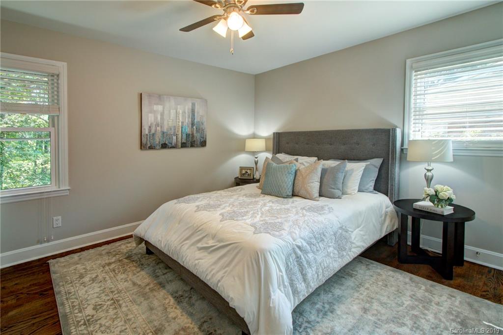 7439 Watercrest Road Charlotte, NC 28210 - Photo 16 of 28 a large bed sitting in a bedroom next to a window
