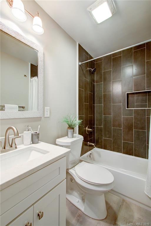 7439 Watercrest Road Charlotte, NC 28210 - Photo 17 of 28 a bathroom with a sink toilet and shower