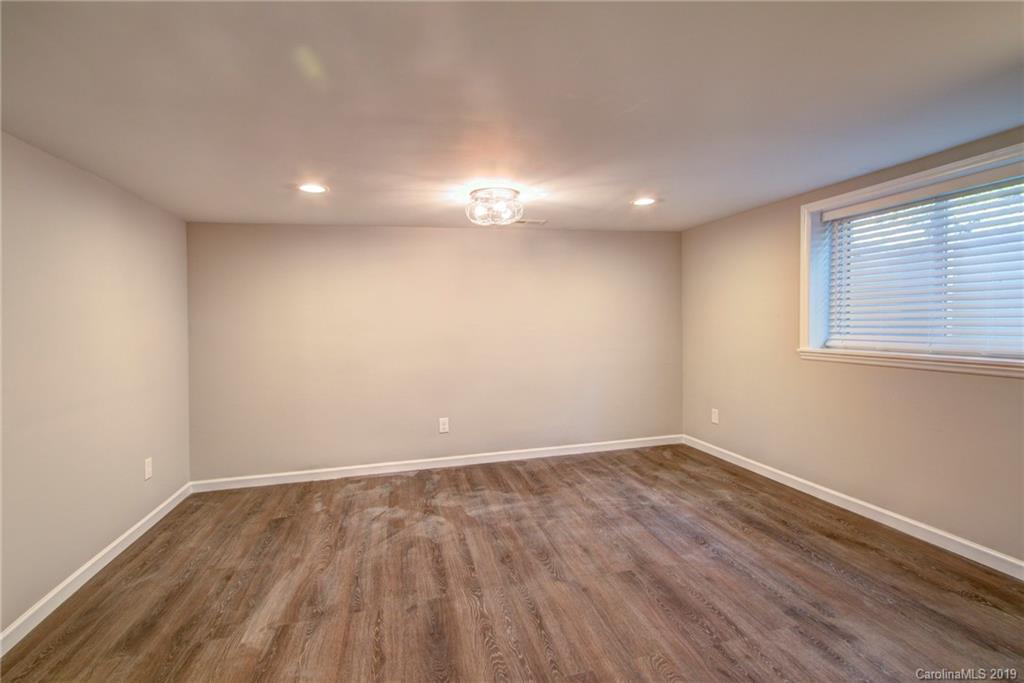 7439 Watercrest Road Charlotte, NC 28210 - Photo 21 of 28 a view of empty room with wooden floor