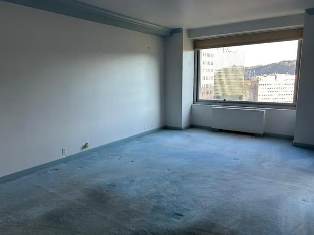 a view of an empty room with a window