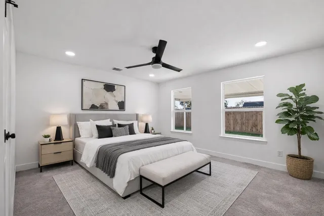 a bedroom with bed and window