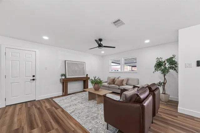 a living room with furniture and window