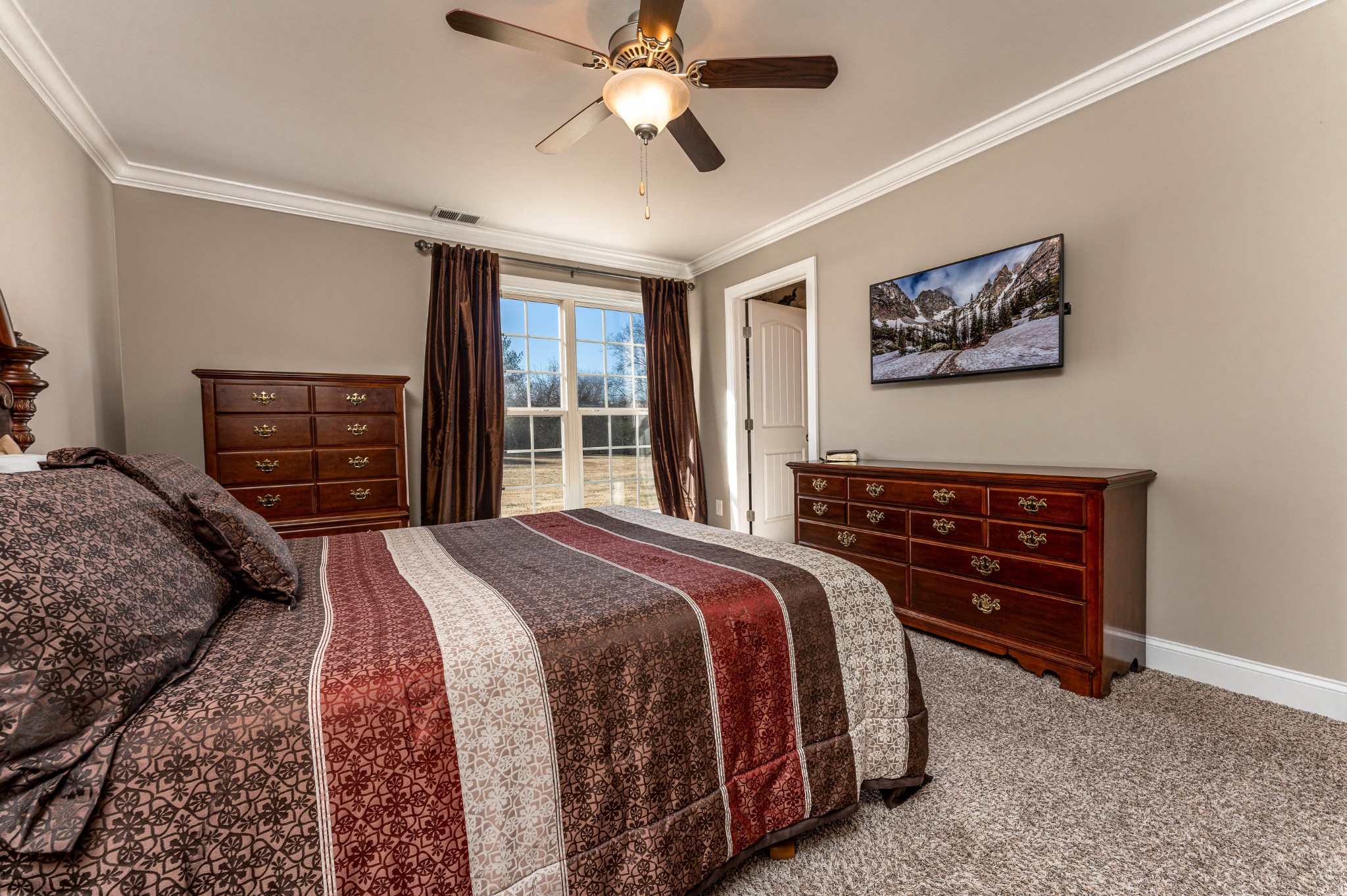 1061 Irish Way Spring Hill, TN 37174 - Photo 12 of 26 a spacious bedroom with a bed and a dresser