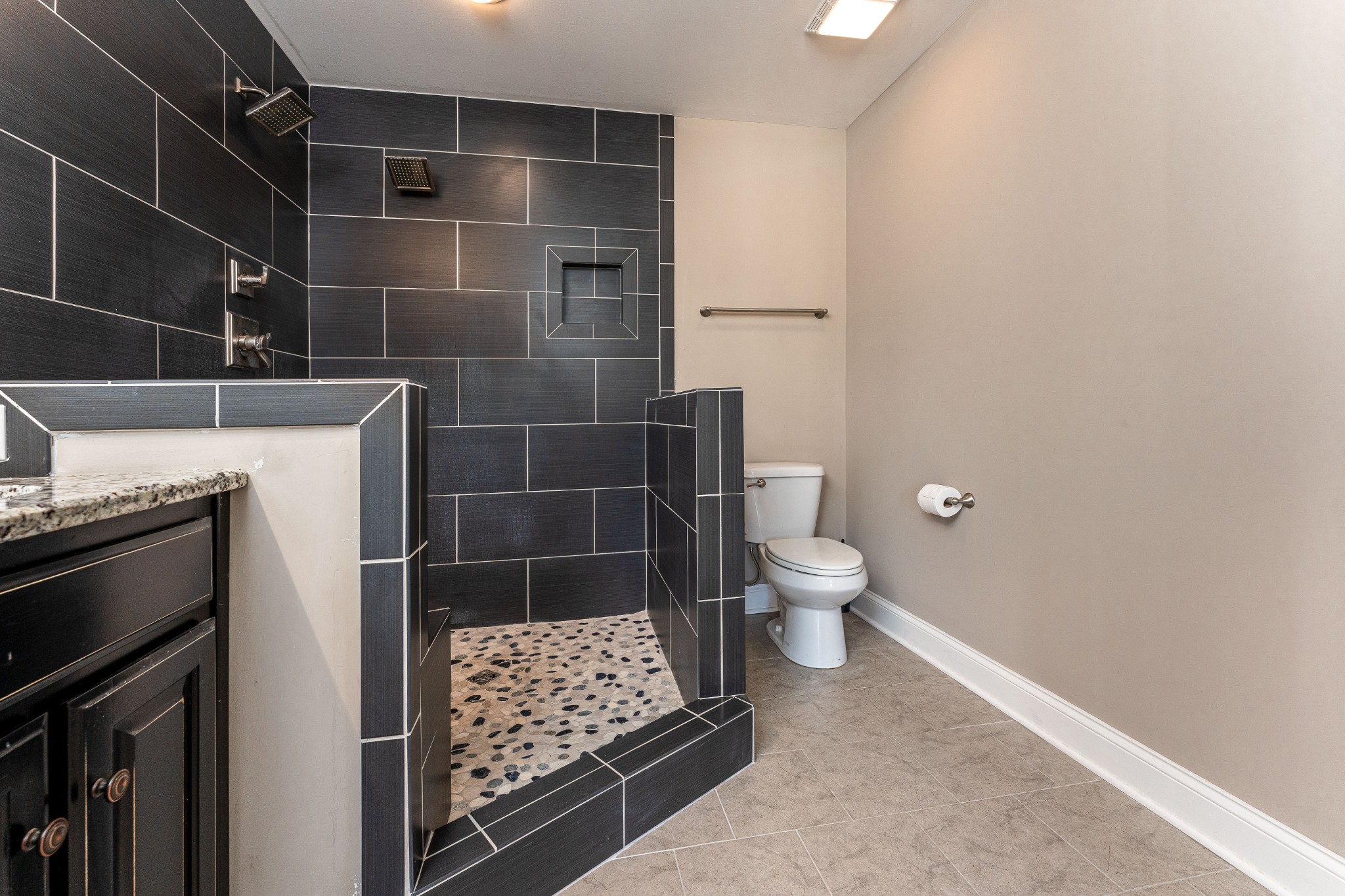 1061 Irish Way Spring Hill, TN 37174 - Photo 14 of 26 a bathroom with a toilet and a shower