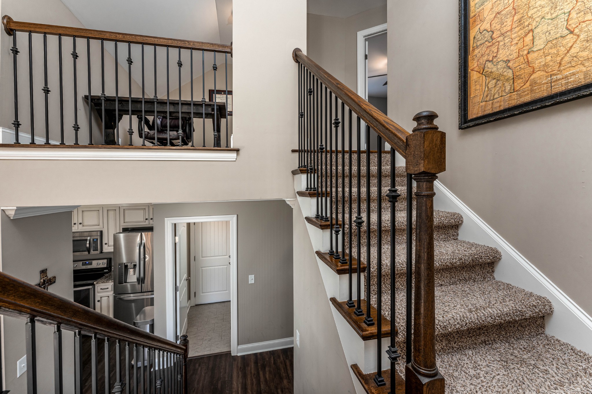 1061 Irish Way Spring Hill, TN 37174 - Photo 17 of 26 a view of a hallway with wooden floor and staircase