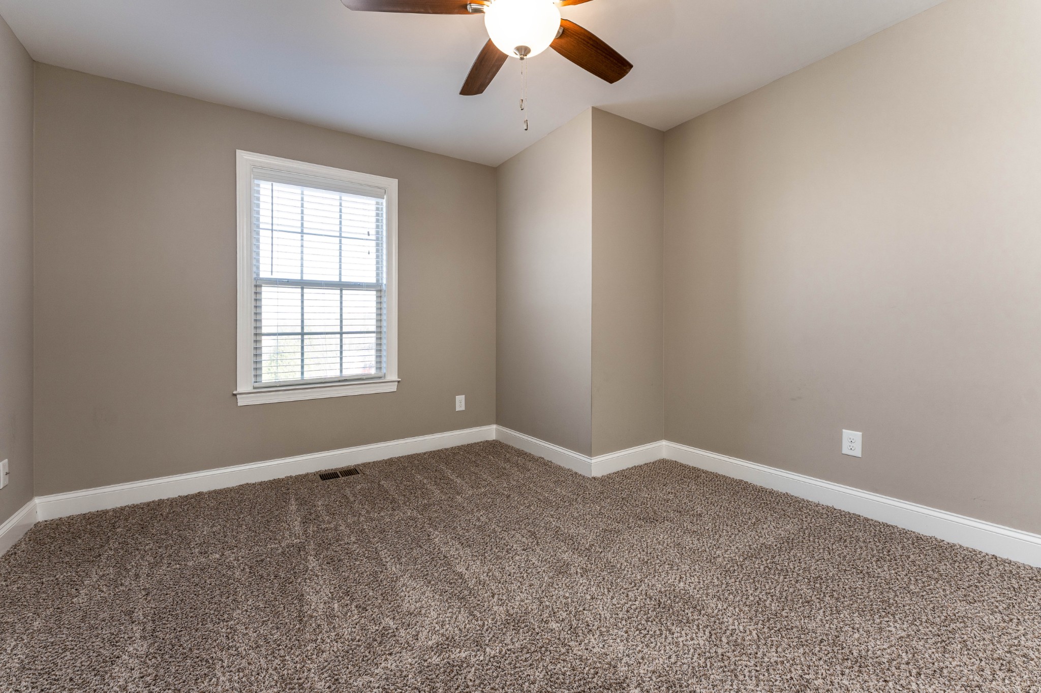 1061 Irish Way Spring Hill, TN 37174 - Photo 19 of 26 an empty room with a window and a ceiling fan