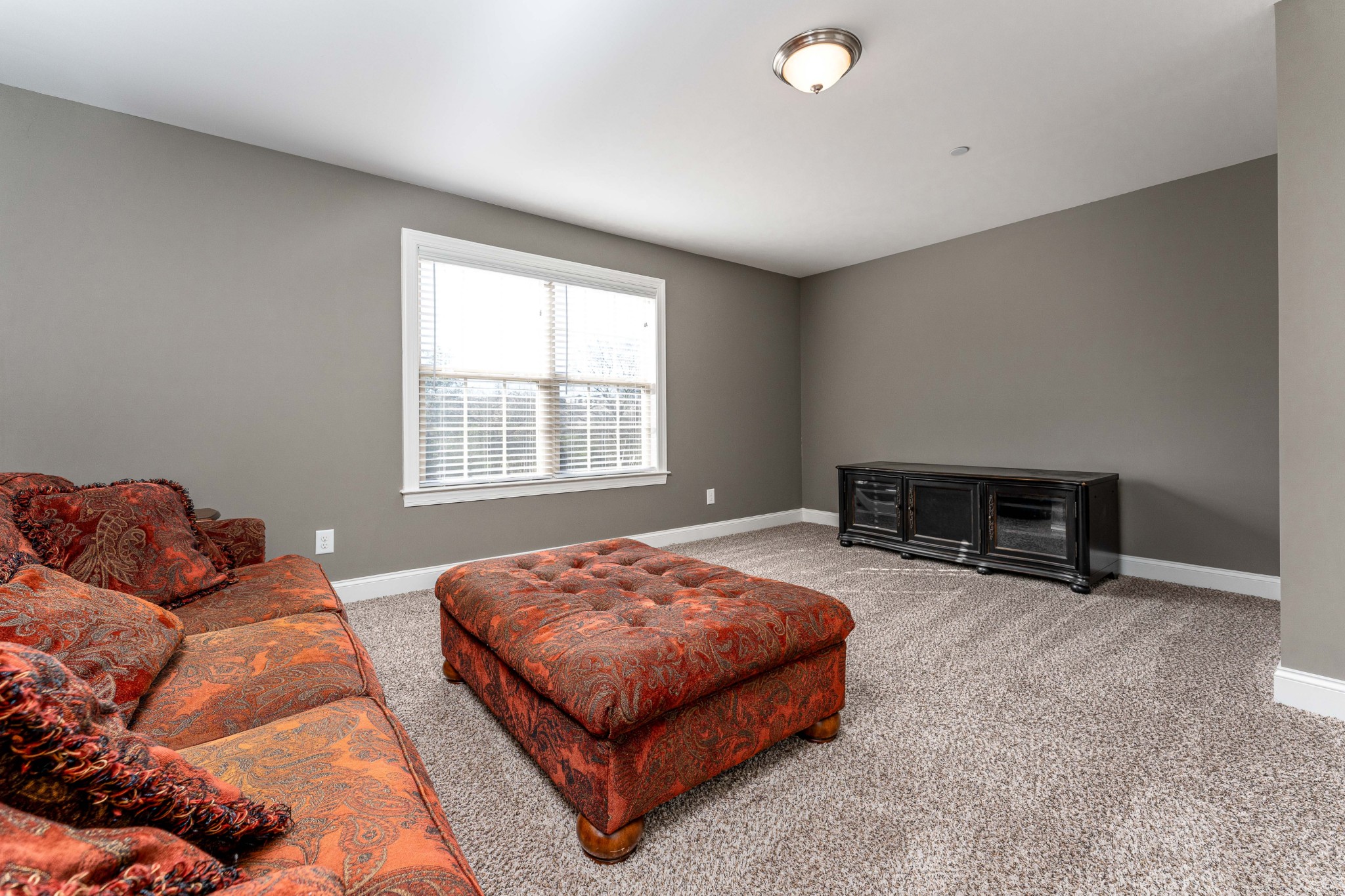 1061 Irish Way Spring Hill, TN 37174 - Photo 22 of 26 a bedroom with a bed and a couch