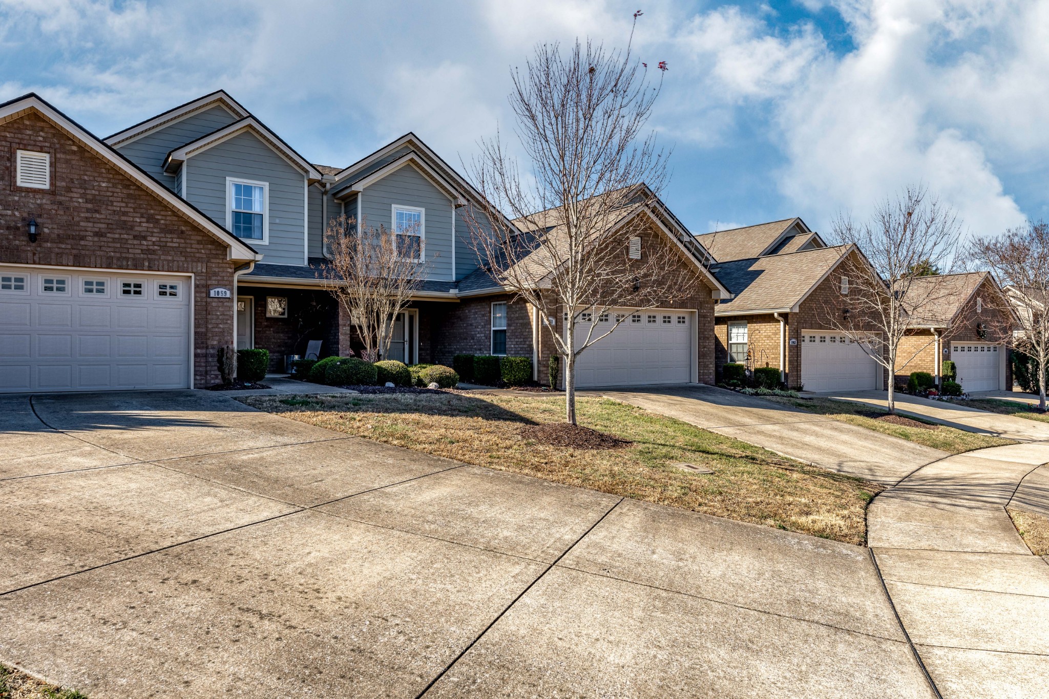 1061 Irish Way Spring Hill, TN 37174 - Photo 3 of 26 a front view of a house with a yard