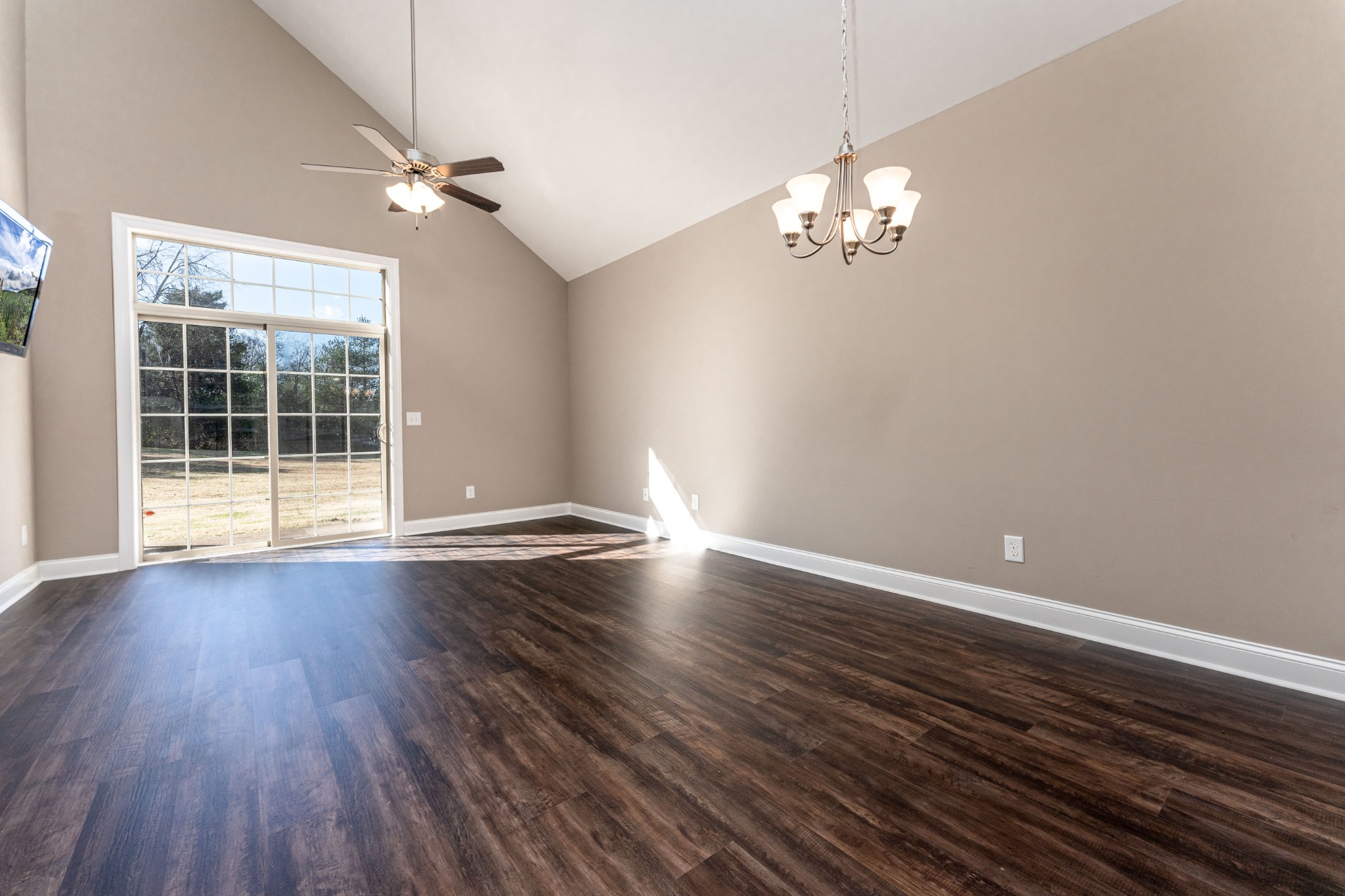 1061 Irish Way Spring Hill, TN 37174 - Photo 5 of 26 wooden floor in an empty room with a window