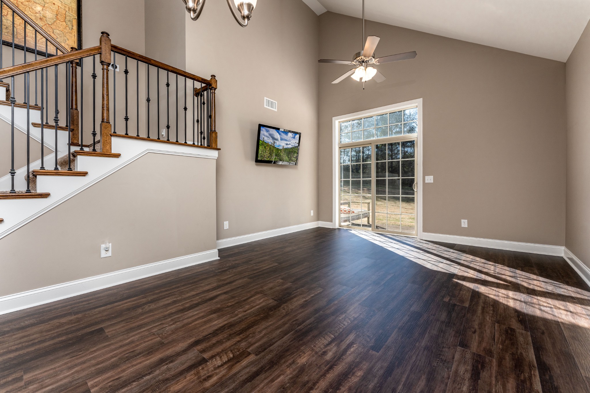 1061 Irish Way Spring Hill, TN 37174 - Photo 7 of 26 an empty room with wooden floor and windows