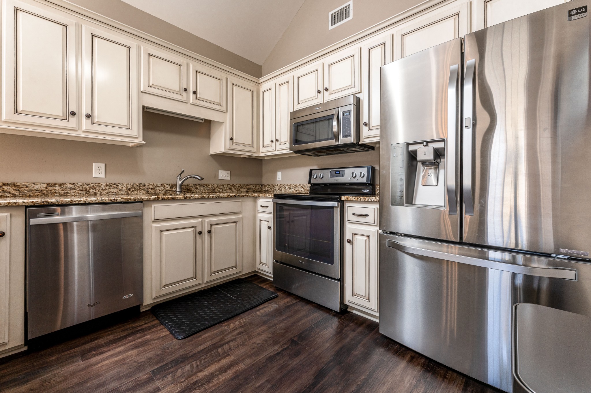 1061 Irish Way Spring Hill, TN 37174 - Photo 8 of 26 a kitchen with stainless steel appliances a refrigerator stove and microwave