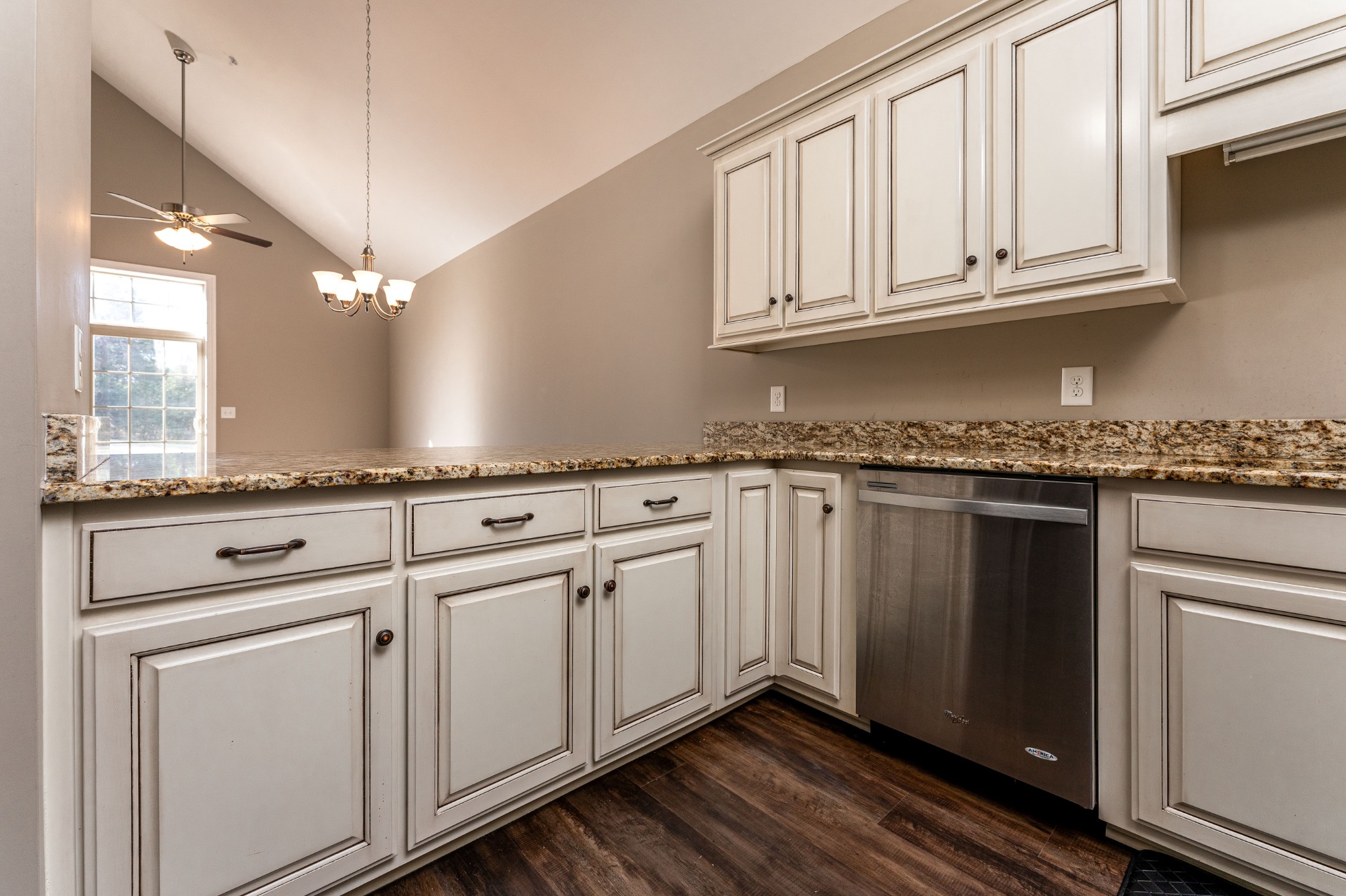 1061 Irish Way Spring Hill, TN 37174 - Photo 9 of 26 a kitchen with granite countertop white cabinets and white appliances
