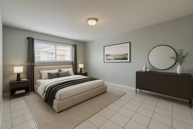 a bedroom with a bed mirror and window