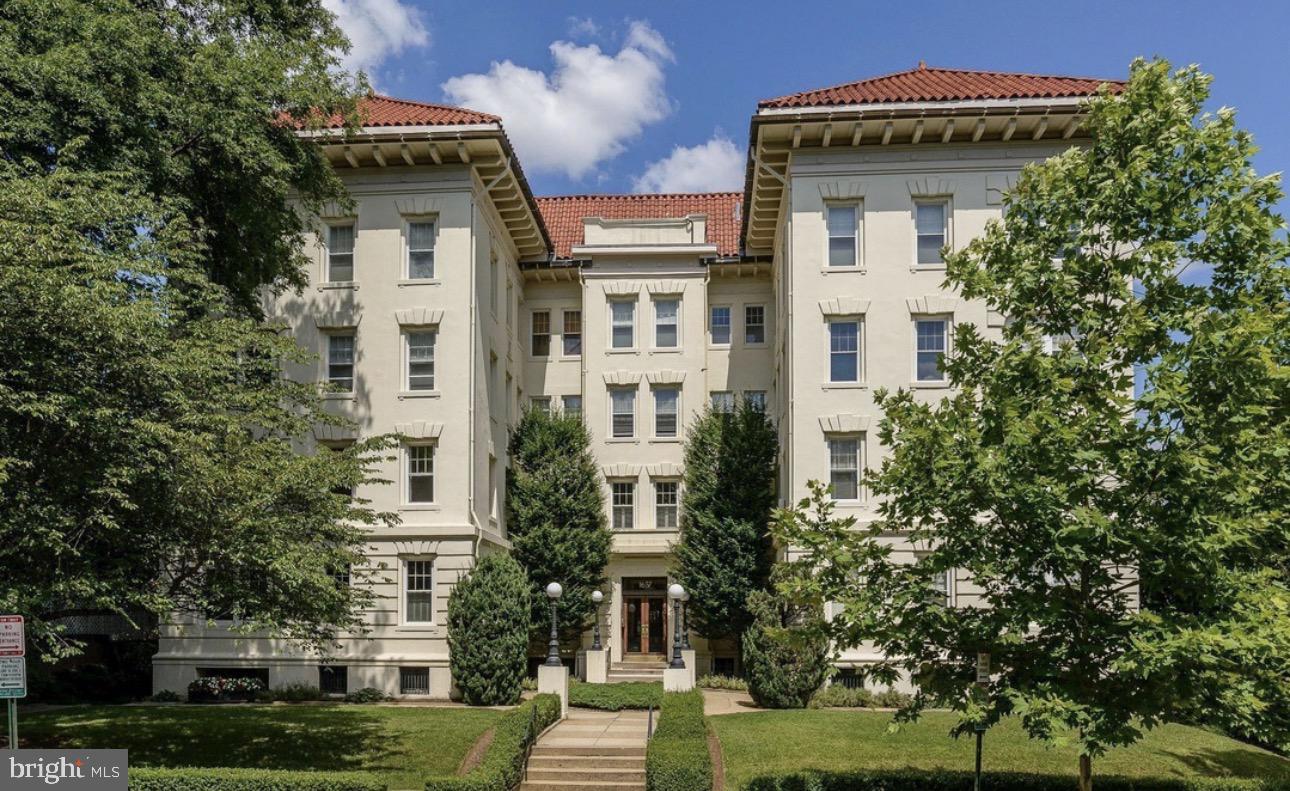 1657 31st Street Northwest, Unit 206 Washington, DC 20007 - Photo 1 of 26 a front view of residential houses with yard and green space
