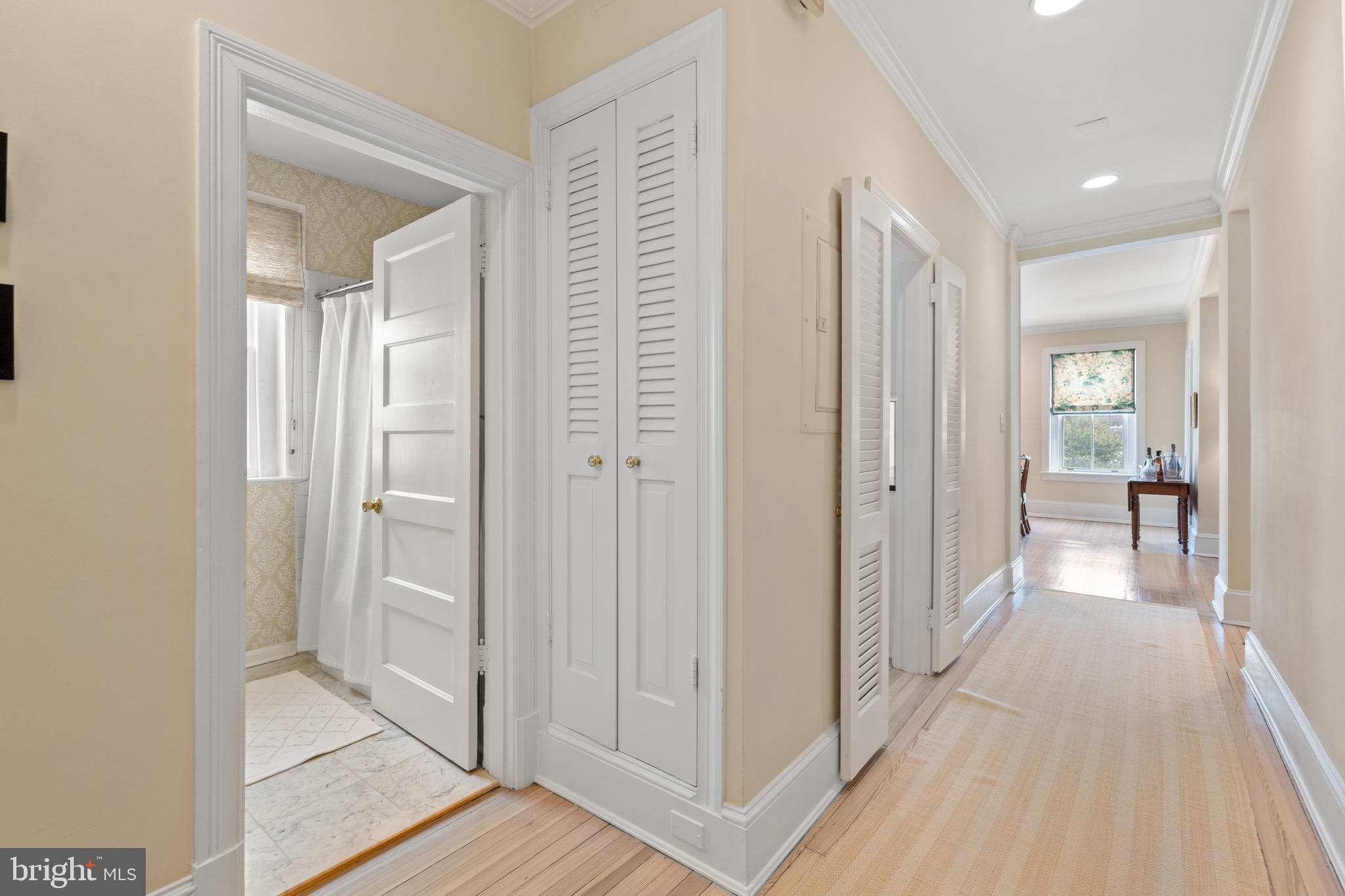 1657 31st Street Northwest, Unit 206 Washington, DC 20007 - Photo 18 of 26 a view of a hallway with closet and wooden floor