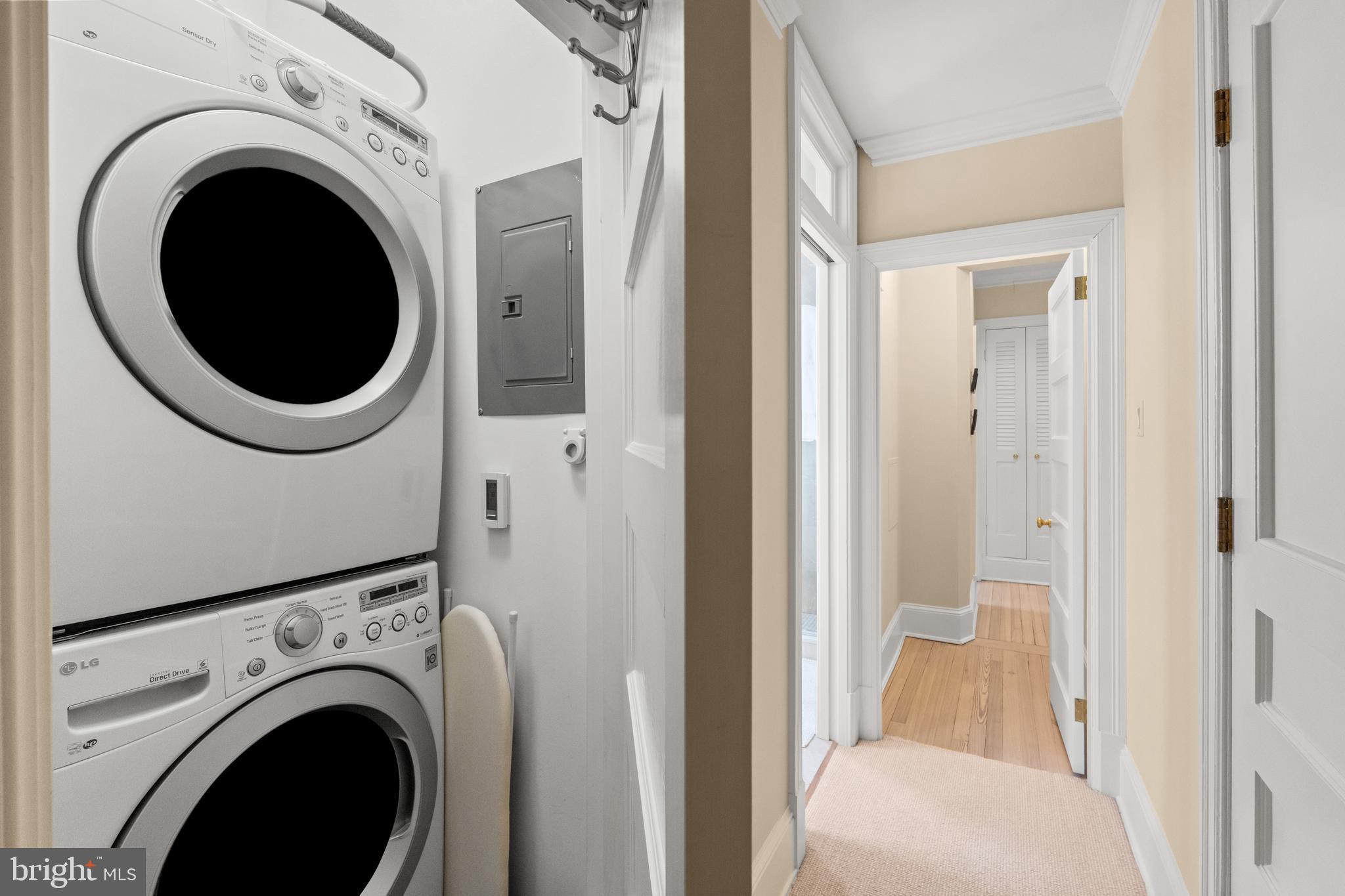 1657 31st Street Northwest, Unit 206 Washington, DC 20007 - Photo 23 of 26 a view of a hallway with washer and dryer