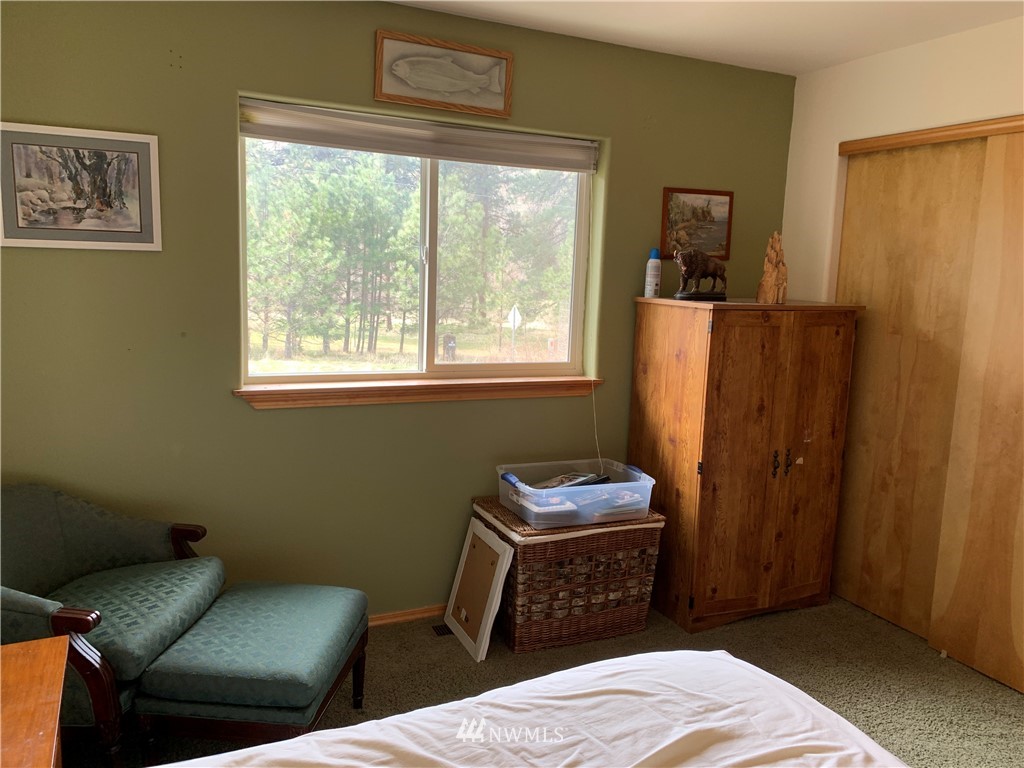 2013 Tucannon Road Pomeroy, WA 99347 - Photo 13 of 28 a bedroom with a bed and a window