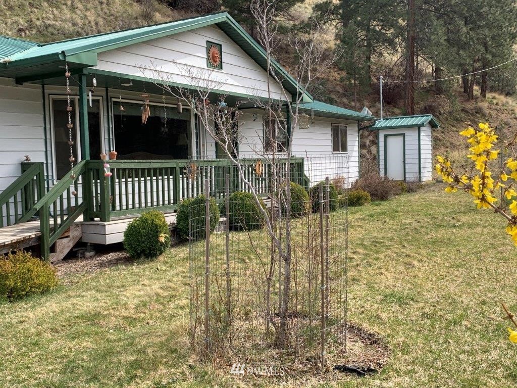 2013 Tucannon Road Pomeroy, WA 99347 - Photo 26 of 28 a view of a house with a small yard and wooden fence