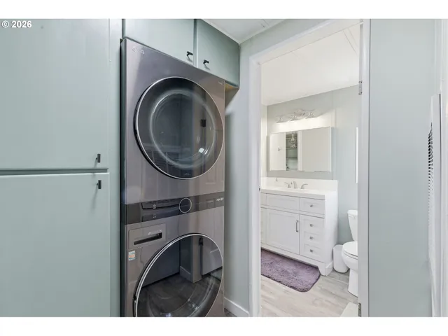 a bathroom with a sink a washer and dryer