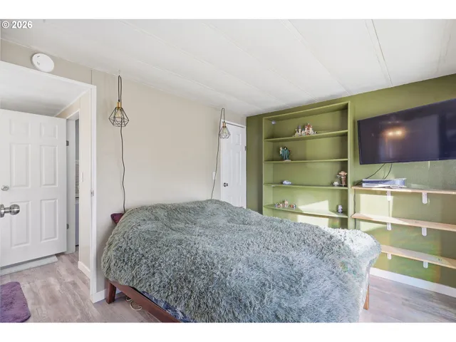 a living room with a bed and furniture