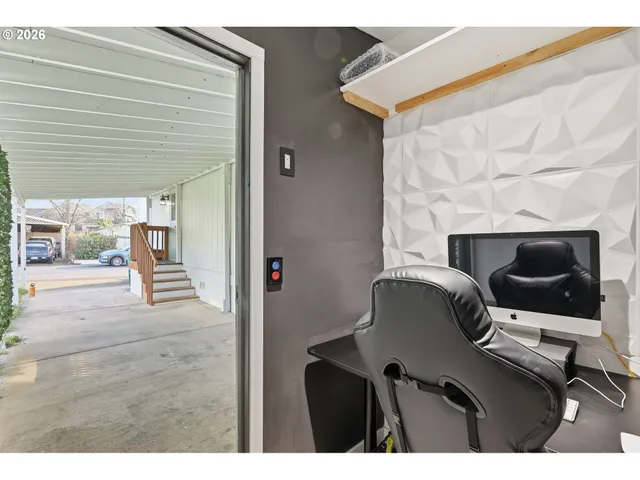 a workspace with furniture and window