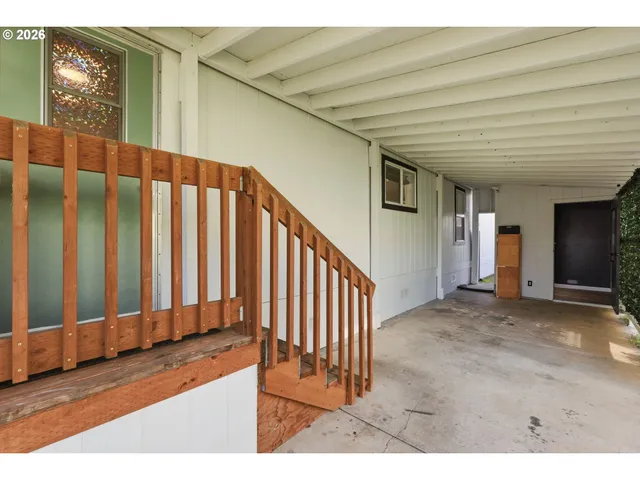 a view of a porch with wooden floor