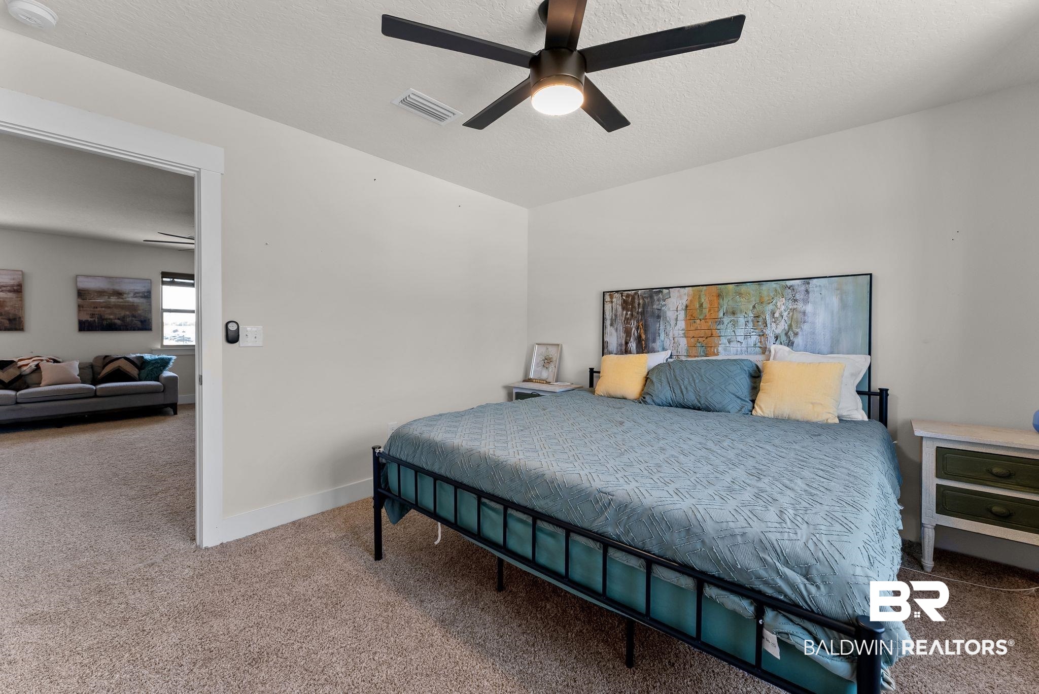 16607 Prado Loop Loxley, AL 36551 - Photo 22 of 46 Carpeted room featuring a ceiling fan with integrated lighting, white walls, and white trim