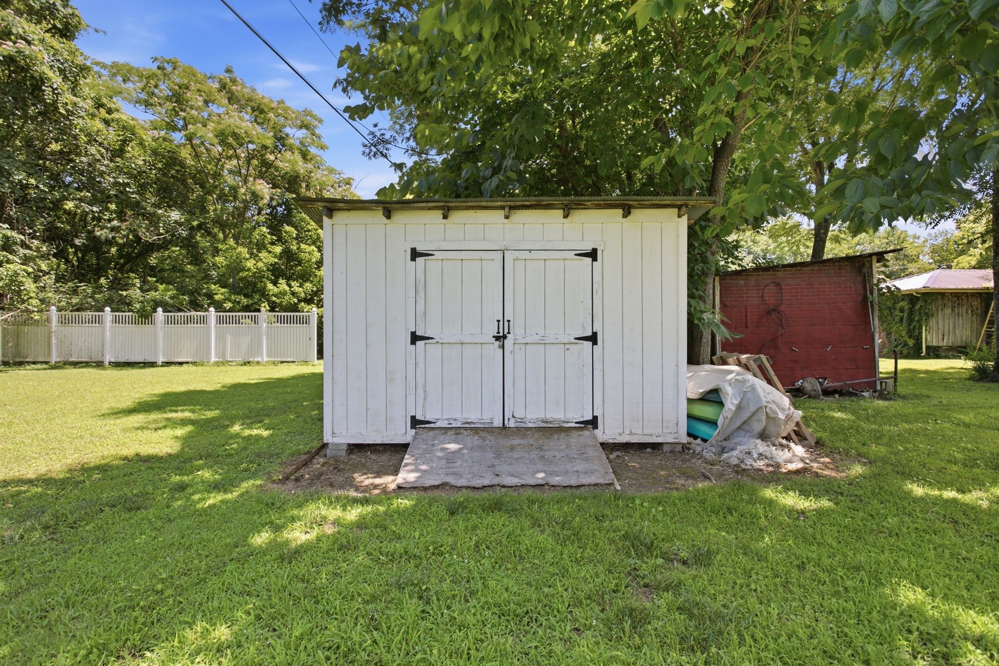 150 Toms Creek Road Linden, TN 37096 - Photo 22 of 23 a view of a backyard with a garden and entertaining space