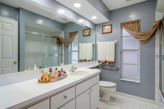 a bathroom with a mirror and a shower