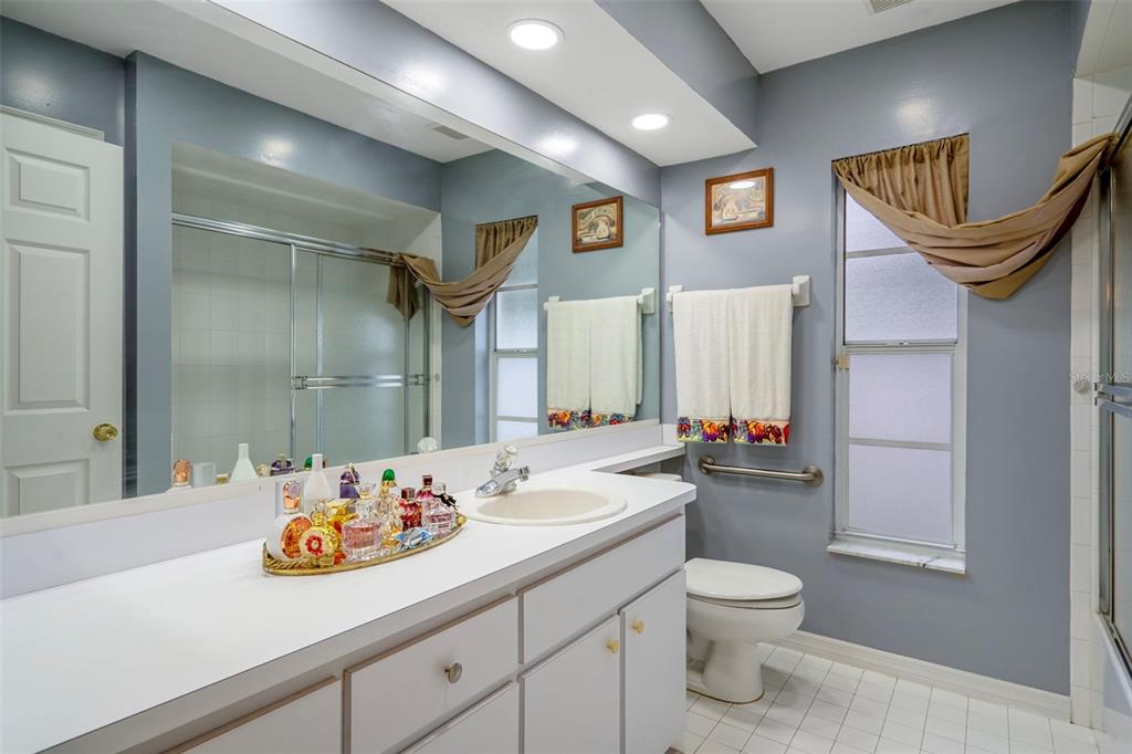 8158 Winding Oak Lane Spring Hill, FL 34606 - Photo 30 of 47 a bathroom with a sink a toilet and shower