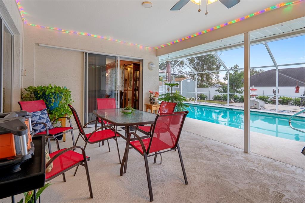 8158 Winding Oak Lane Spring Hill, FL 34606 - Photo 35 of 47 a view of a dining room with furniture window and outside view