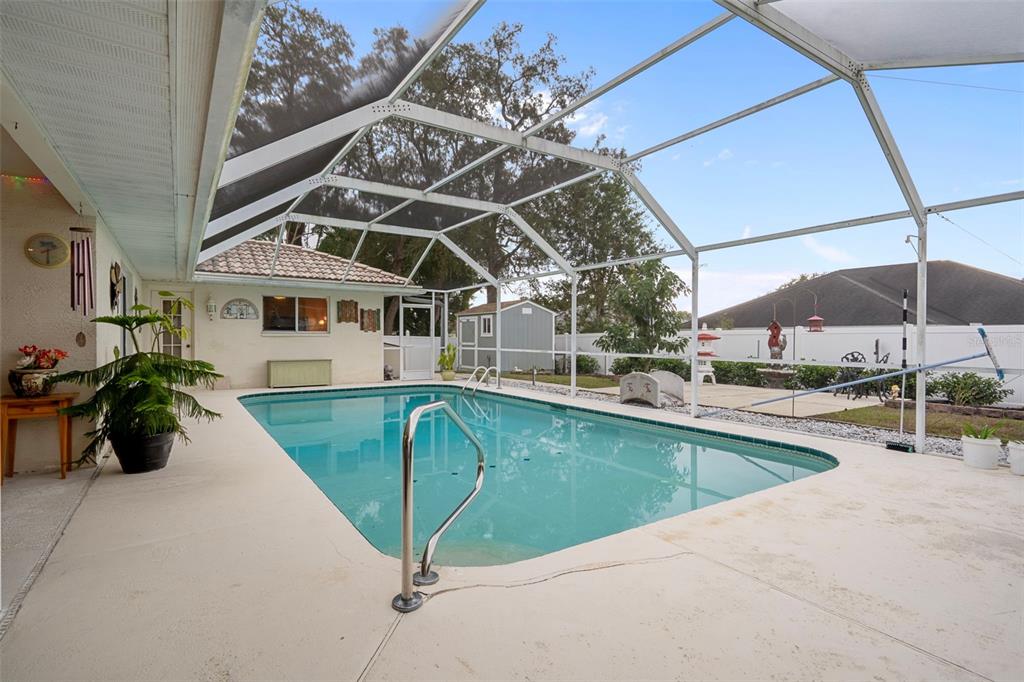 8158 Winding Oak Lane Spring Hill, FL 34606 - Photo 39 of 47 a view of a swimming pool with a patio
