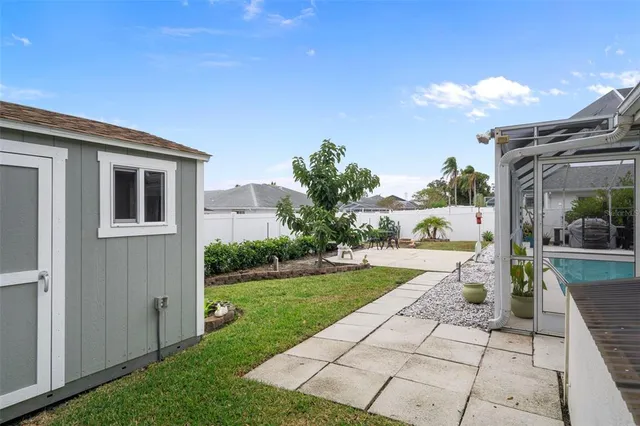 a view of a house with backyard porch and sitting area
