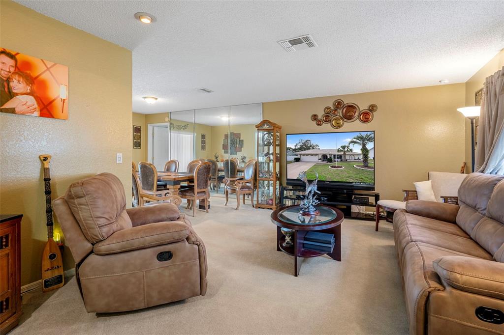 8158 Winding Oak Lane Spring Hill, FL 34606 - Photo 8 of 47 a living room with furniture and wooden floor