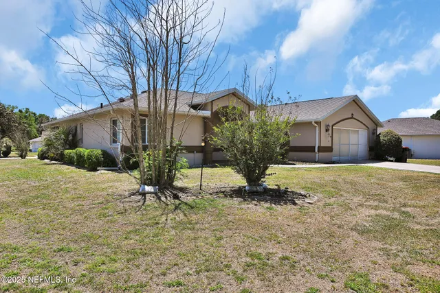 a house view with a garden space