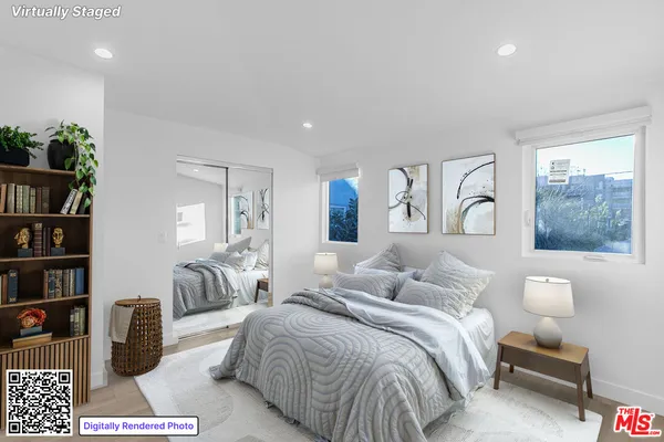 a bedroom with a bed lamps and window